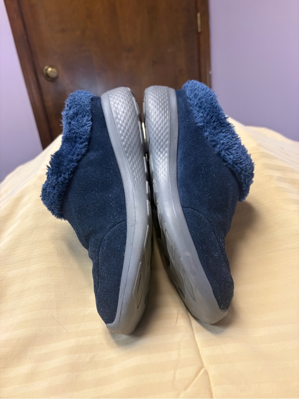 Women’s Skechers On-the-Go Joy. Navy suede and faux fur mules.